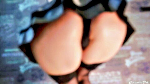 Close-up of sexy girl's big ass in short skirt, standing and exposed