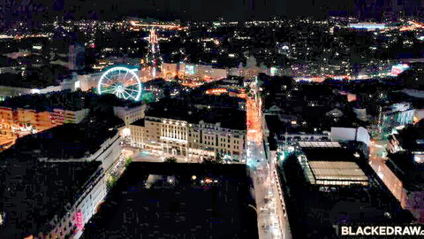 Little Dragon in stunning 4K nighttime cityscape with Ferris wheel lights
