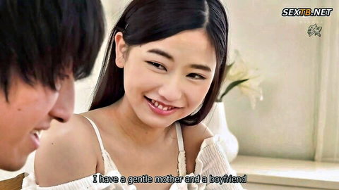 Petite smiling Japanese teen in low-cut tank top showing cleavage with boyfriend