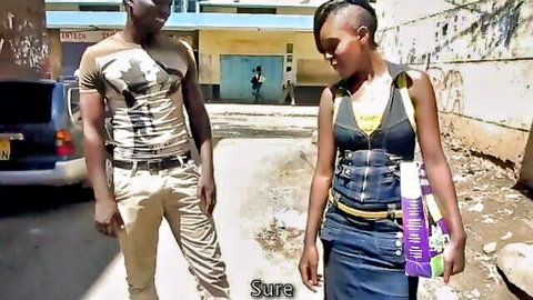 Ebony babe in denim overalls flirts with black stud on gritty street pickup.