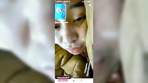 Indonesian hijab teen in intimate video call selfie with boyfriend