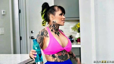 Xwife Karen in pink bikini, tattooed curvy body with green-streaked hair