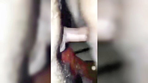 Blurry close-up of mature woman's big pussy with hand inserted after incest sex