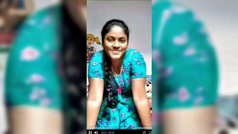 Smiling Tamil woman in floral green dress with big ass