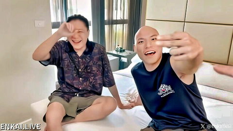 Two smiling Chinese men posing playfully on bed in casual clothes, gay AV thumbnail