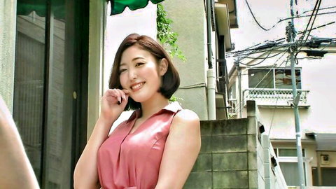 Beautiful Asian wife smiling in sexy pink dress outdoors