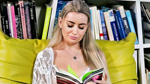 Young blonde in sheer lace top reading book teasing deep cleavage and perky tits