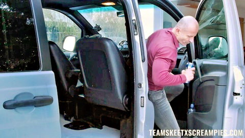 Bald man in pink shirt films inside open van door for creampie tease