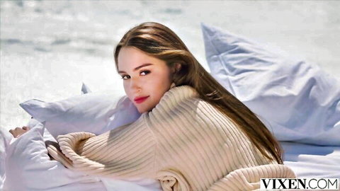 Sonya Blaze seductive smile in cozy sweater on pillows, Vixen blowjob preview