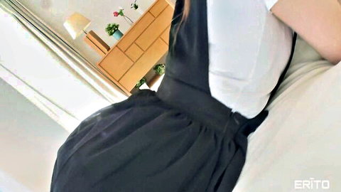 Tsubaki Leo in schoolgirl uniform, seductive back view on bed, teasing pose