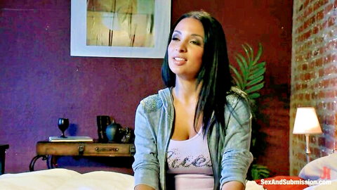 Anissa Kate seductive in pink tank top and denim jacket, BDSM fantasy vibe