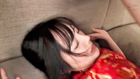 Asian woman in red qipao dress in trance state, eyes closed, intense orgasm expression