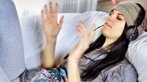 Brunette woman with headphones relaxing in casual clothes, amazing pussy preview