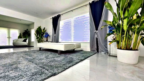 Lissa Aires unreal ass video thumbnail: luxurious room with plants, white couch