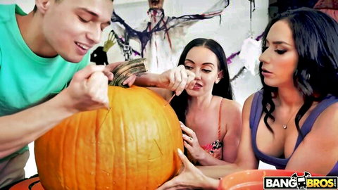 Busty Latina brunettes with medium tits and tanned stud carving pumpkin in Halloween tease