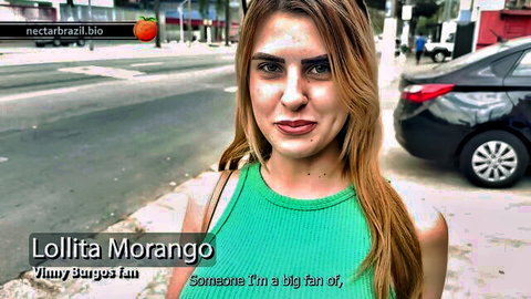 Blonde Latina influencer Lolita Morango teasing with big tits in green top on public street
