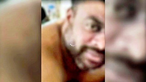 Blurry close-up of shirtless Indian old man grimacing with pleasure solo homemade