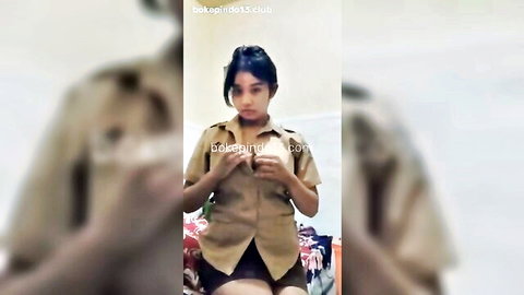 Young Indonesian woman in khaki scout uniform teasing solo