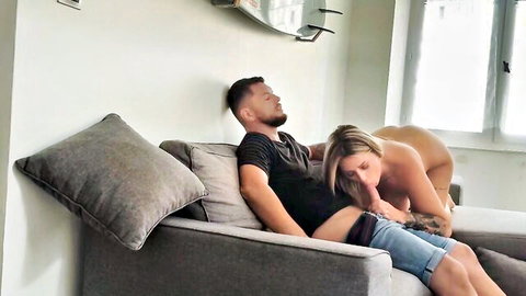 Blonde pregnant woman seducing sleeping man on sofa in hot threesome