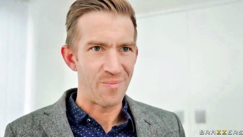 Handsome suited man smirking in office for Brazzers The Perfect Plus One