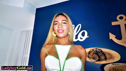 Smiling blonde Thai ladyboy teen Dara in sexy white dress