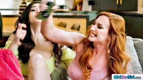 Topless brunette babe with perky tits chugs green liquid as smiling redhead watches in lesbian tease
