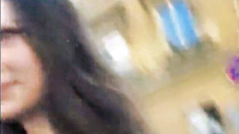 Blurry closeup of sexy Asian babe with glasses smirking ready to suck cock