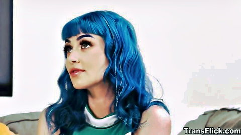 Blue-haired cis woman in green top, seductive gaze in trans threesome