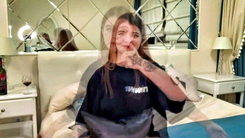 Tattooed redhead girlfriend shushing in oversized tee after facial fun