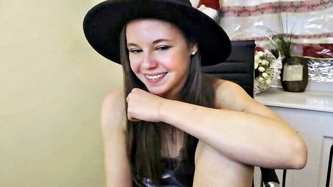 Marice Shine smiling in black hat on Chaturbate webcam show