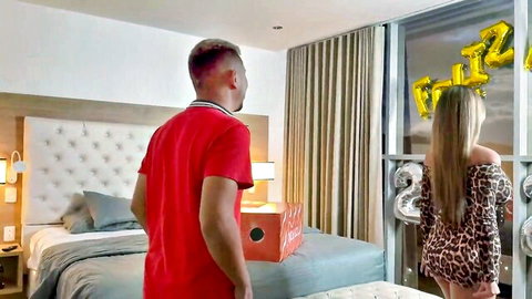 Blonde in tight leopard dress flaunting big ass as man watches in luxury hotel room