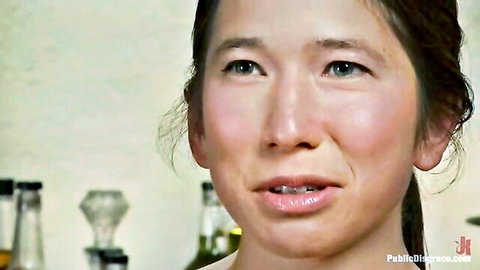 Smiling Asian beauty with glossy plump lips in public pickup tease