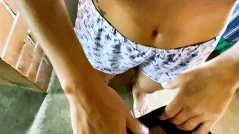 POV closeup of curvy South Asian woman pulling down floral shorts exposing navel and pussy mound with hands on thighs