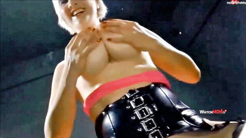 Egon Kowalski as busty MILF exposing huge tits in black corset