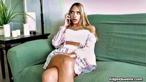 Blonde petite babe in floral bralette and skirt talking on phone with legs spread teasing on couch