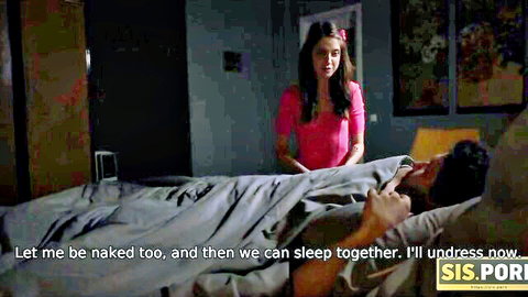 Stepsis in pink top stands by bed, ready to undress and sleep naked with stepbro