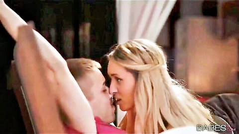 Jessi Gold passionately kissing muscular guy in erotic couple scene