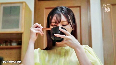 Japanese newlywed in yellow blouse holding bowl, innocent kitchen moment before stepdad encounter