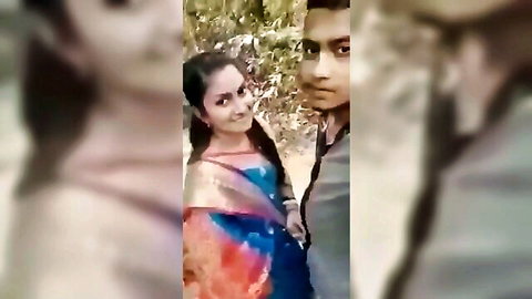 Desi Indian girlfriend in colorful saree with boyfriend outdoor intimate selfie