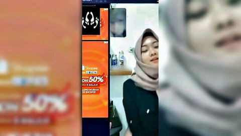 Sherly Crawford hijab-clad beauty in intimate solo moment, eyes closed in ecstasy