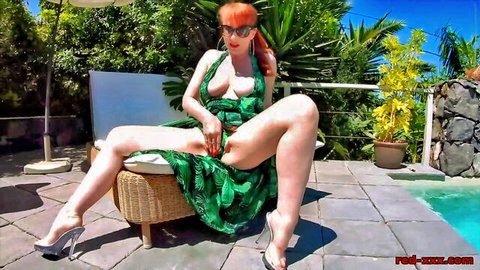 Curvy redhead cougar masturbating in revealing green dress