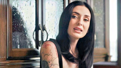 Charlotte Sins seductive gaze in black top, tattooed shoulder from Bellesa Films
