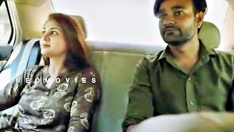 Indian couple in car sharing intimate gaze, teasing adult moment