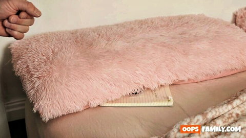 Penelope Kay as horny stepdaughter teasing with hands on pink blanket