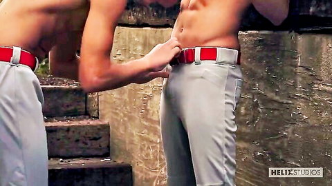 Ian Levine and muscular buddy in teasing baseball pants belt adjustment