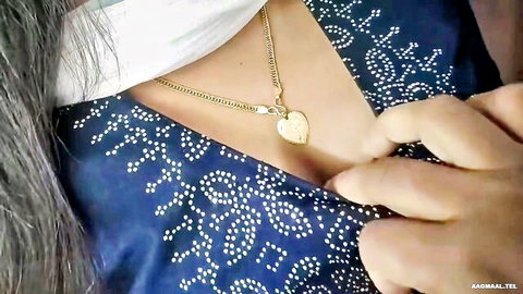Mallu Vaishnavy teasing in low-cut blue embroidered dress with heart necklace