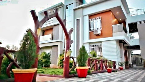 Yorgelis Carrillo's steamy scene at luxurious modern home with lush garden exterior