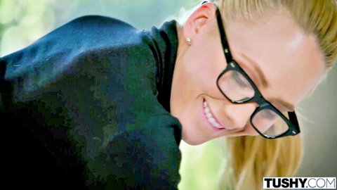 AJ Applegate as curvy blonde secretary in glasses, smiling seductively