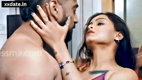 Indian couple in passionate hotel embrace, girlfriend in purple dress