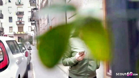 Chloe Lamour huge hanging tits teen talking on phone in green jacket on street